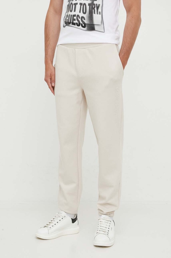 Calvin Klein spodnie dresowe z elastanem beżowy K10K111566