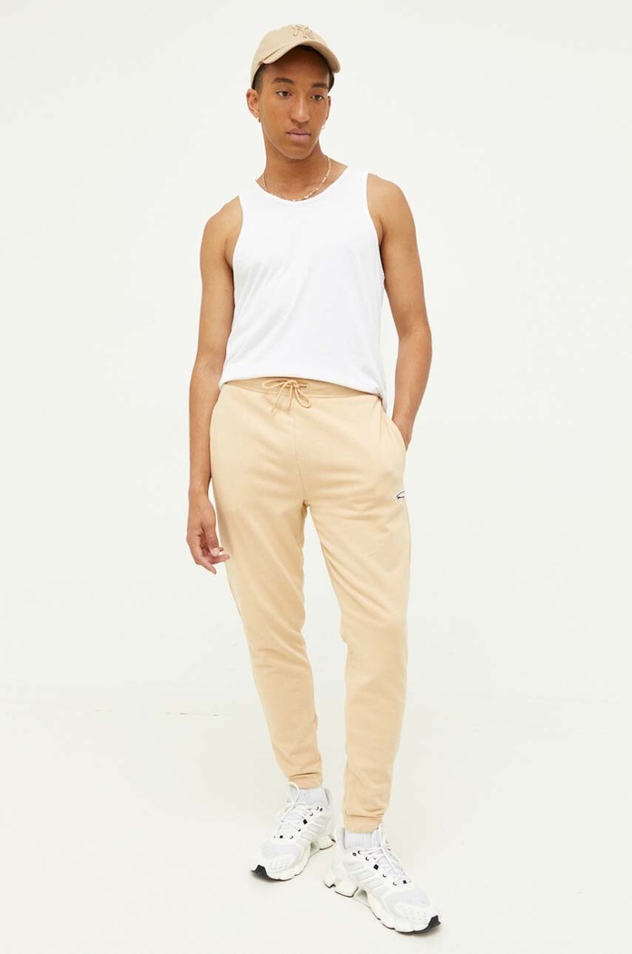 Tommy Jeans spodnie dresowe dzianina beżowy DM0DM16874