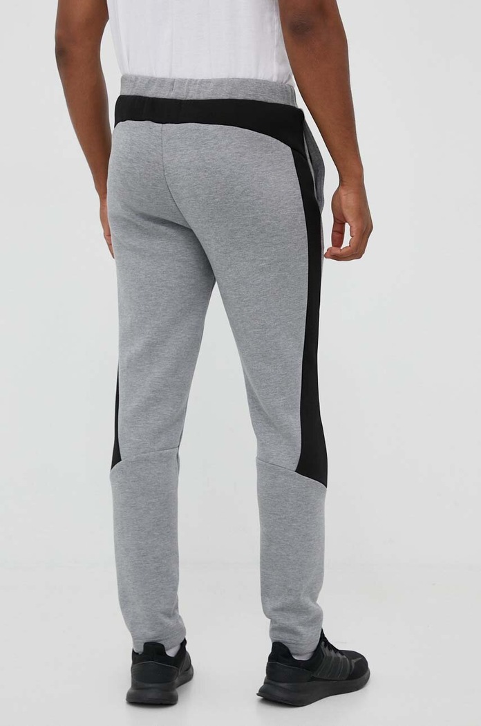 Ruházat Puma edzőnadrág EVOSTRIPE 585814 szürke