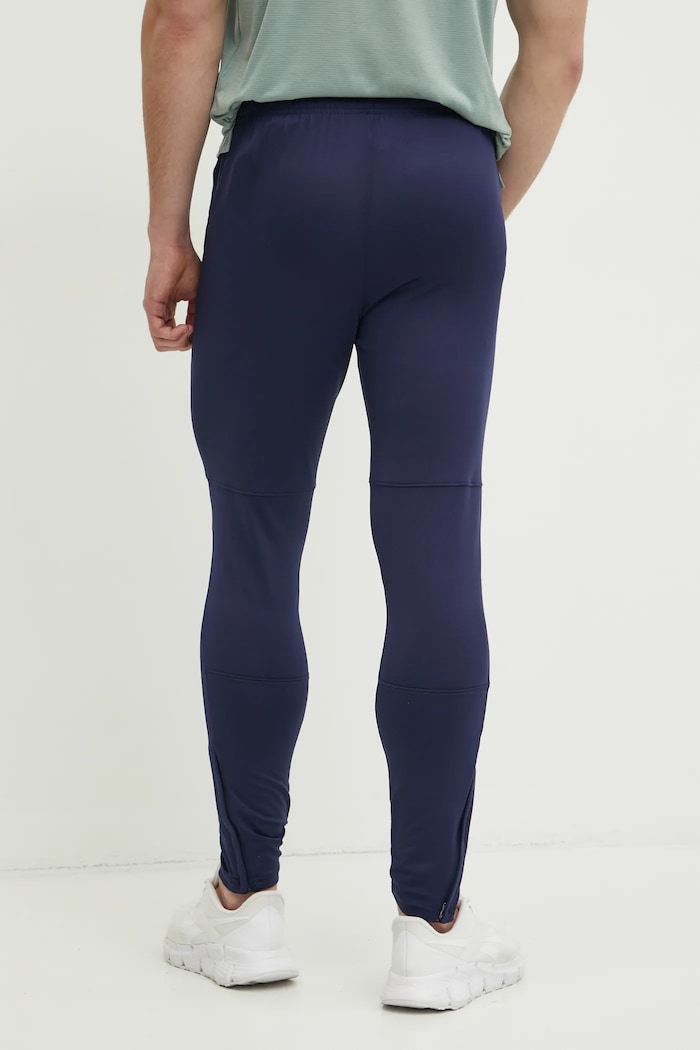 Tréningové nohavice Under Armour Challenger 1379587 tmavomodrá AW24