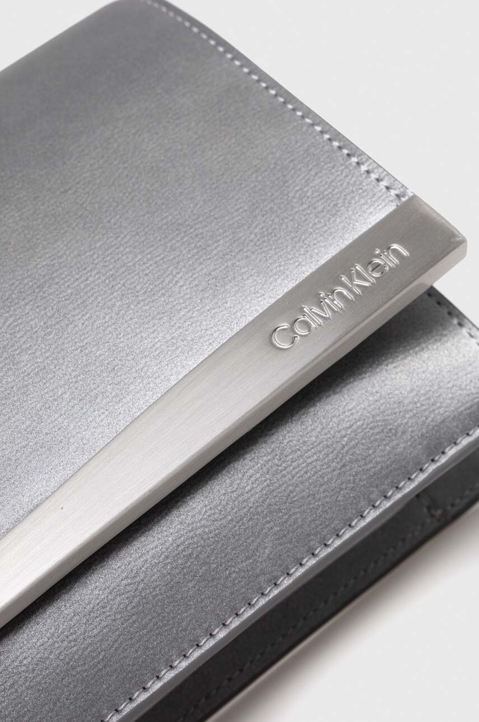Akcesoria Calvin Klein kopertówka K60K611309 srebrny
