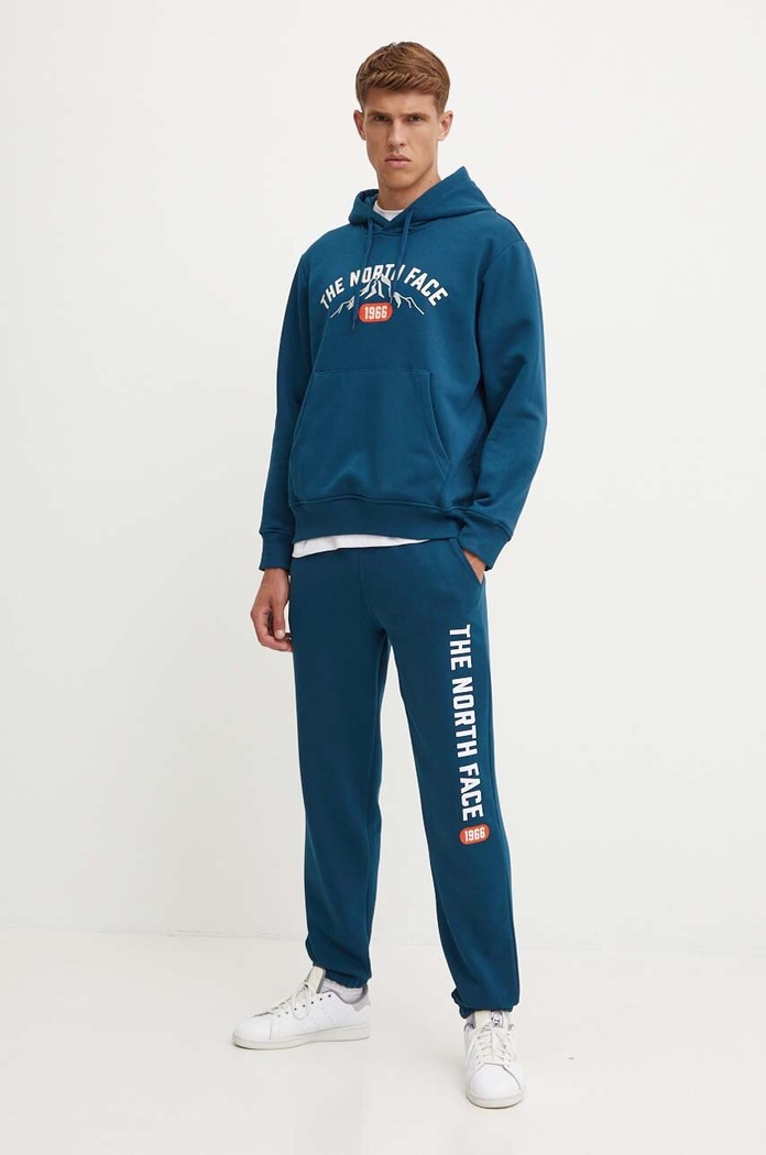 Mikina The North Face Hoodie Varsity Graphic NF0A89DJ1NO1 tyrkysová AW24
