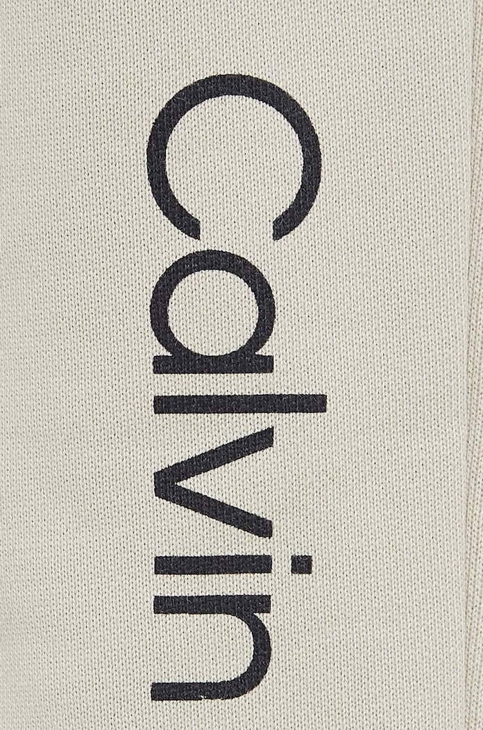 Calvin Klein Jeans spodnie dresowe bawełniane dziecięce REGULAR JOGGER beżowy IU0IU00681.128.176.9BYH