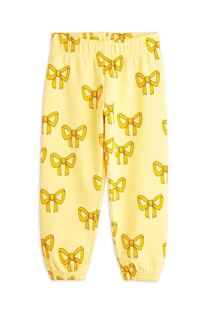 Mini Rodini Dětské bavlněné tepláky Mini Rodini Bow 2473013323 žlutá AW24
