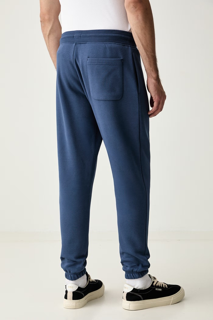 Odzież Tommy Jeans spodnie dresowe męskie z bawełną DM0DM20473 granatowy