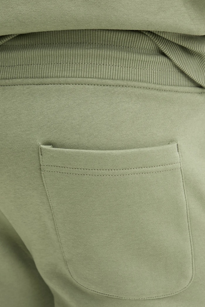 Spodnie dresowe męskie z bawełną Tommy Jeans DM0DM20473 zielony