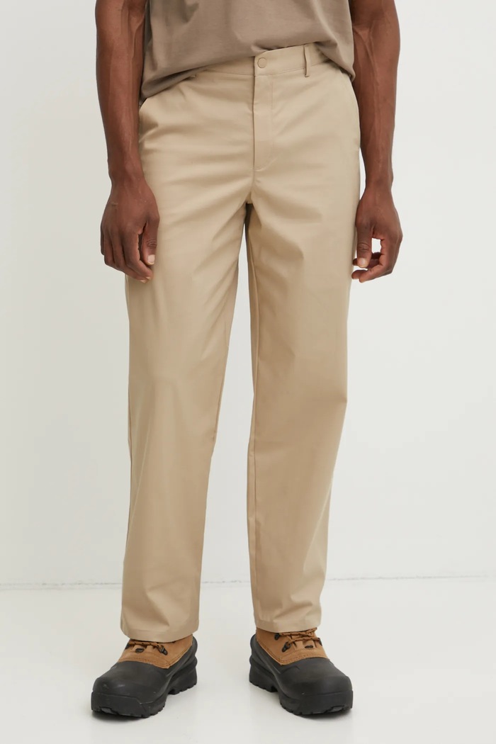 Kalhoty New Balance Athletics Standard Pant 30" látka béžová MP43560SOT