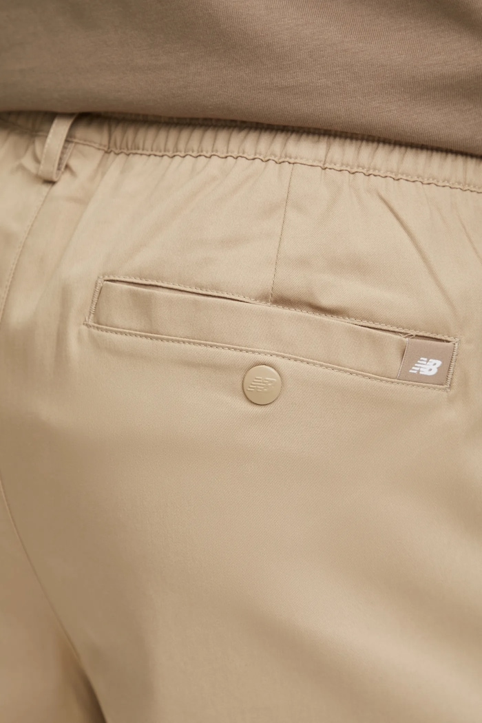 Kalhoty New Balance Athletics Standard Pant 30" béžová MP43560SOT