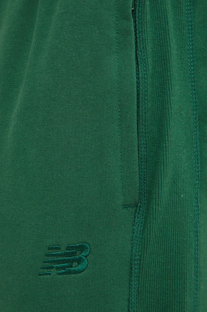 New Balance spodnie dresowe bawełniane zielony MP41508NWG