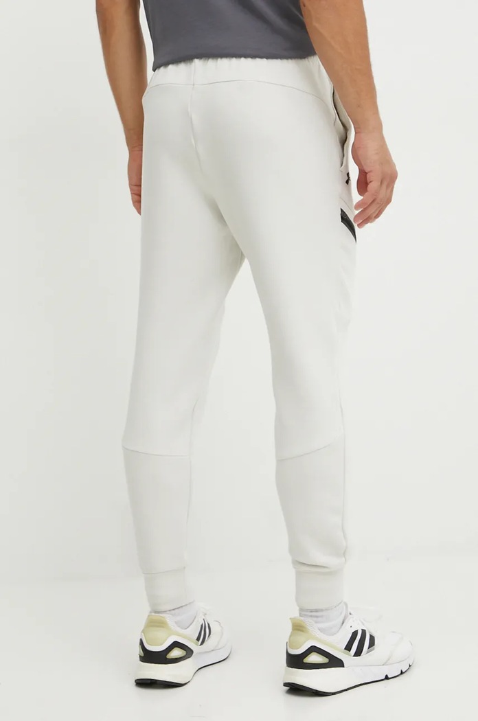 Oblačila Under Armour trenirka moška Unstoppable Fleece 1389353 bež