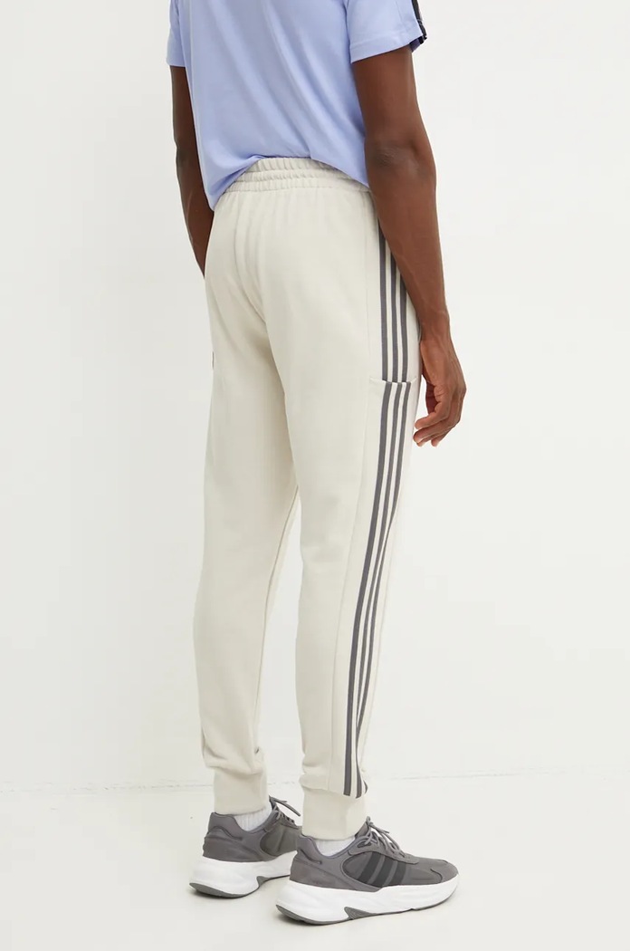 Oblečení Bavlněné tepláky adidas Essentials IW7682 béžová