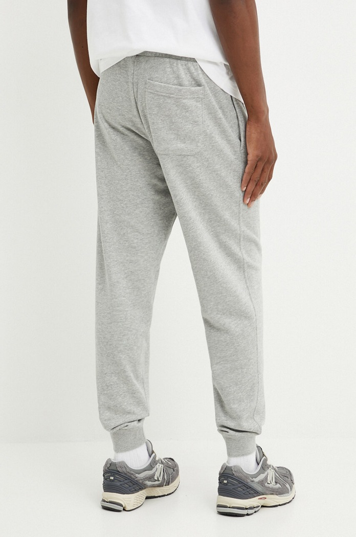 Odzież Converse spodnie dresowe 10026982.A02 szary