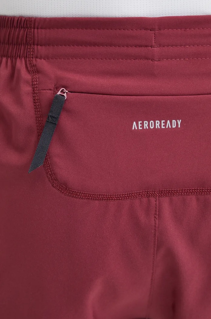 Bežecké šortky adidas Performance Own The Run Base IZ4088 burgundské