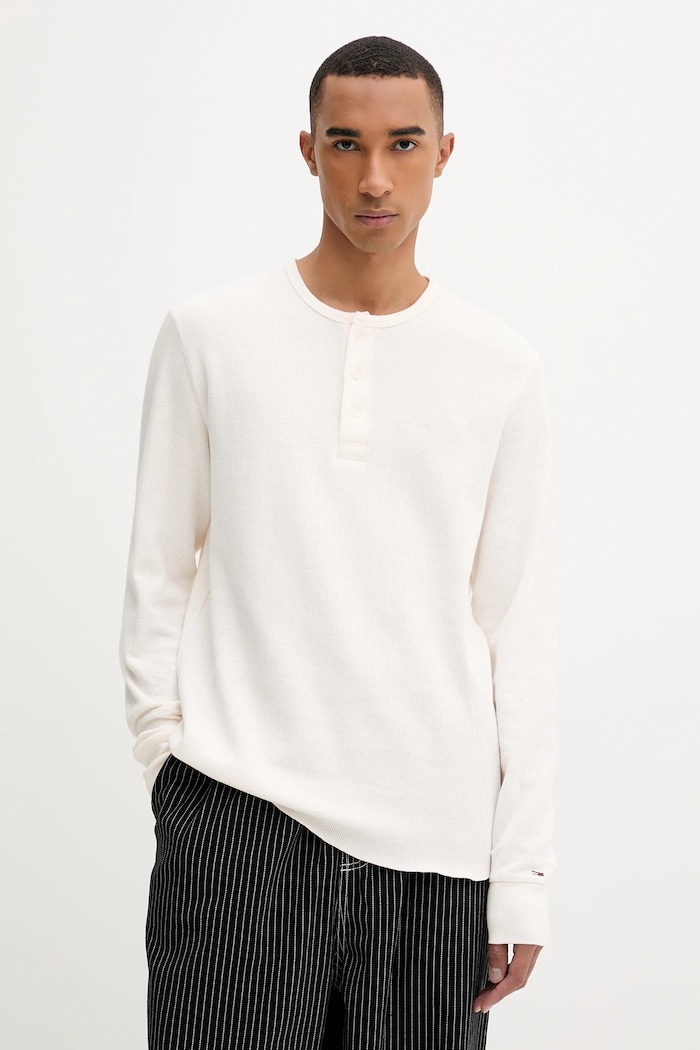 Bavlnené tričko s dlhým rukávom Tommy Jeans jednofarebný béžová DM0DM21812