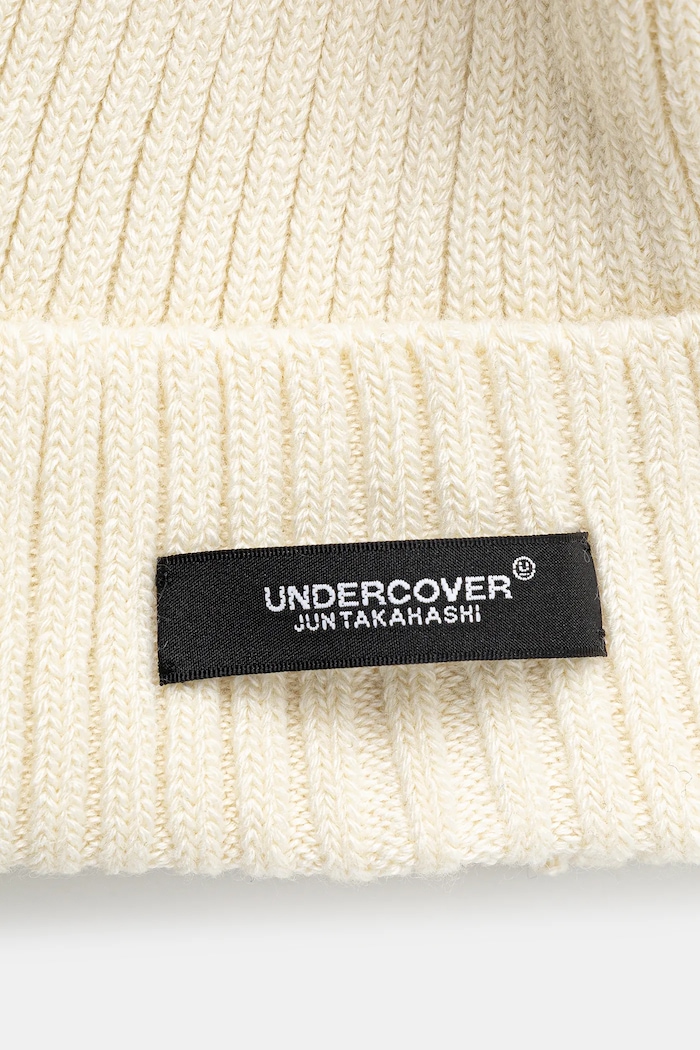 Doplňky Čepice z vlněné směsi Undercover Beanie UC2E4H02 béžová