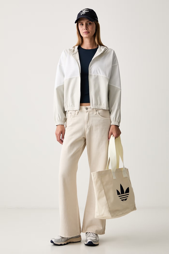 Under Armour geacă de tranziție pentru femei Rival Woven 6004849 bej SS26