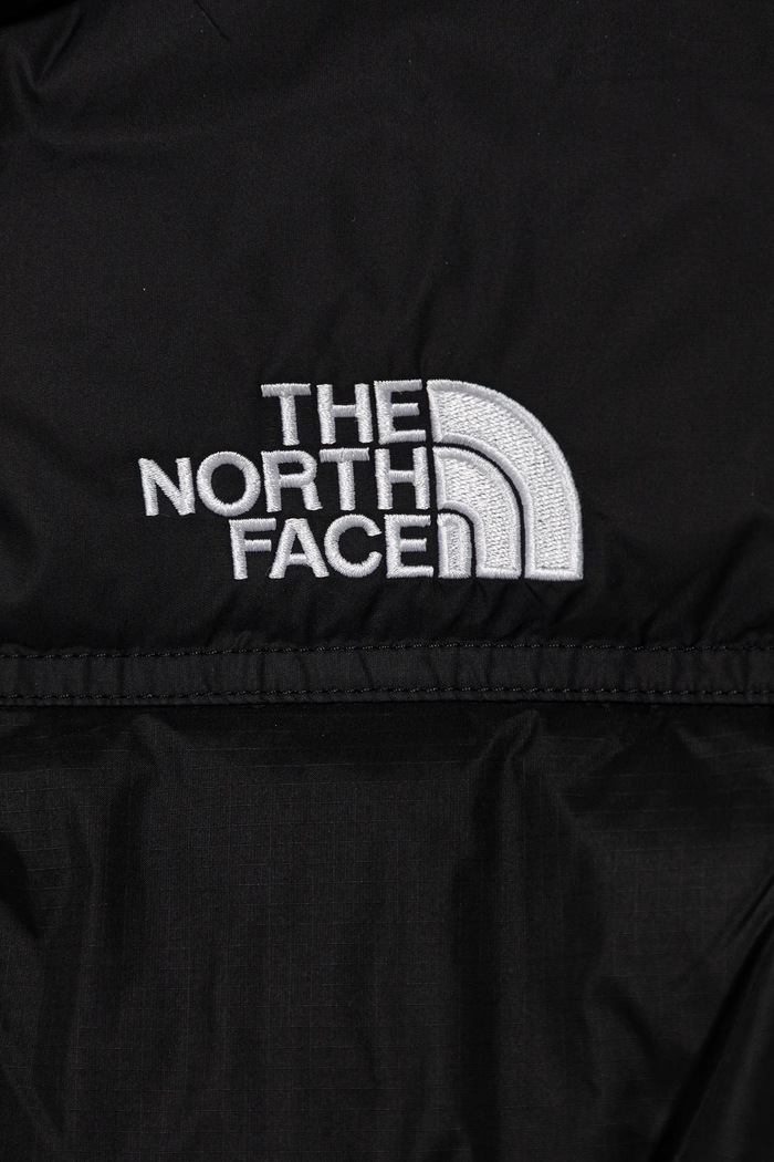 Chlapec Detská páperová vesta The North Face TEEN 1996 RETRO NUPTSE VEST NF0A8A4BGOG1 čierna