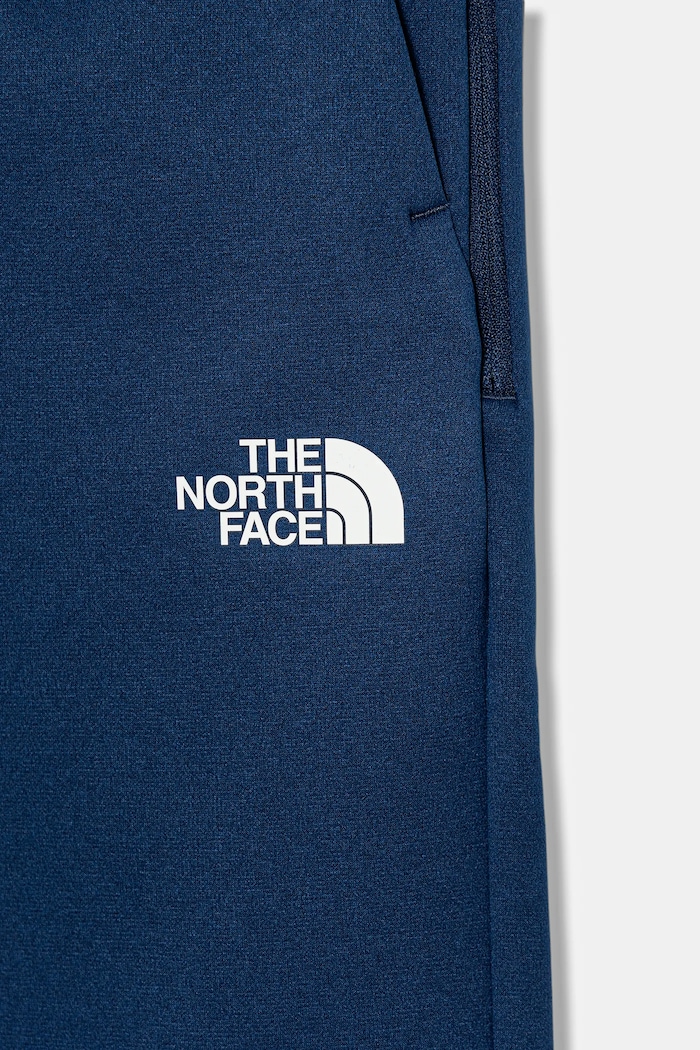 Chlapec Detské tepláky The North Face B MOUNTAIN ATHLETICS JOGGERS NF0A89HW8Z41 tmavomodrá