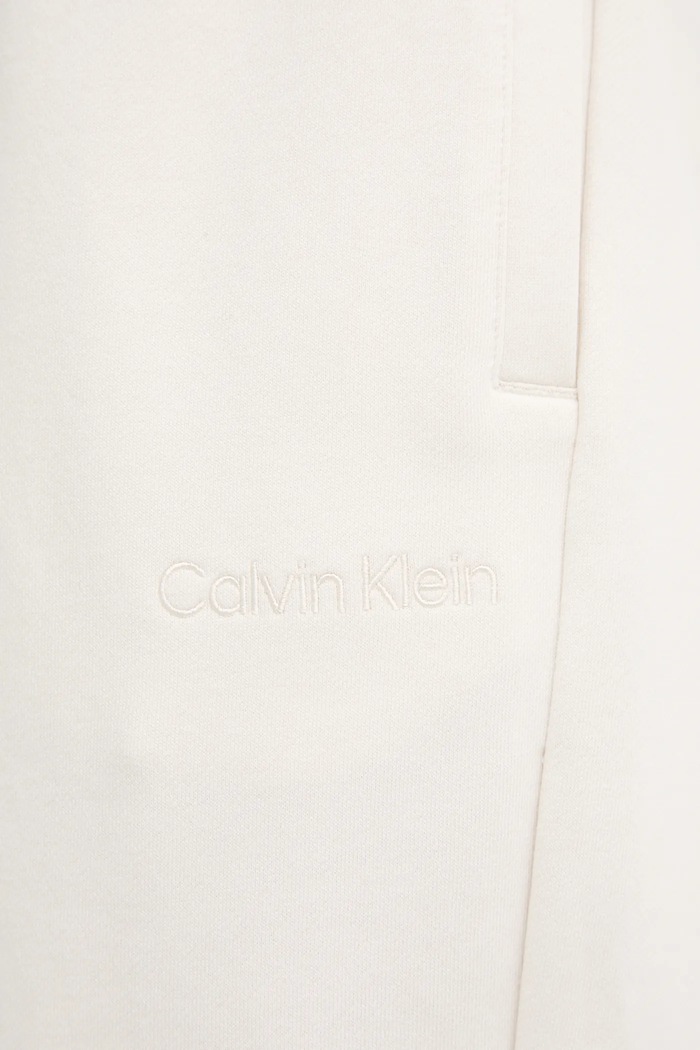 Bavlněné tepláky Calvin Klein béžová LV044C904G