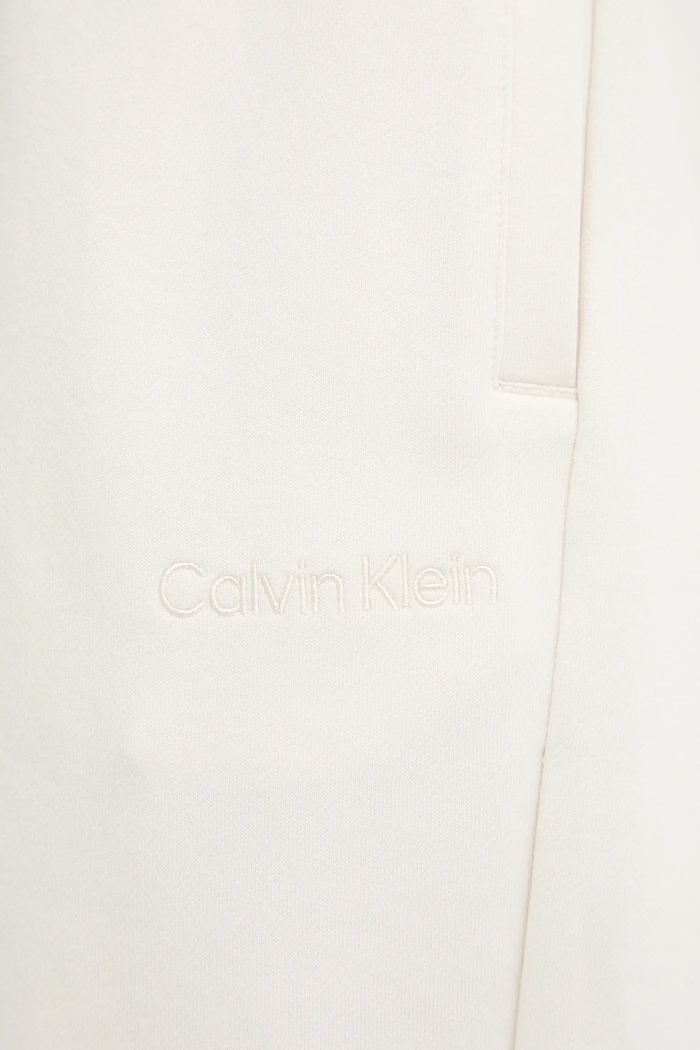 Bavlněné tepláky Calvin Klein béžová LV044C904G