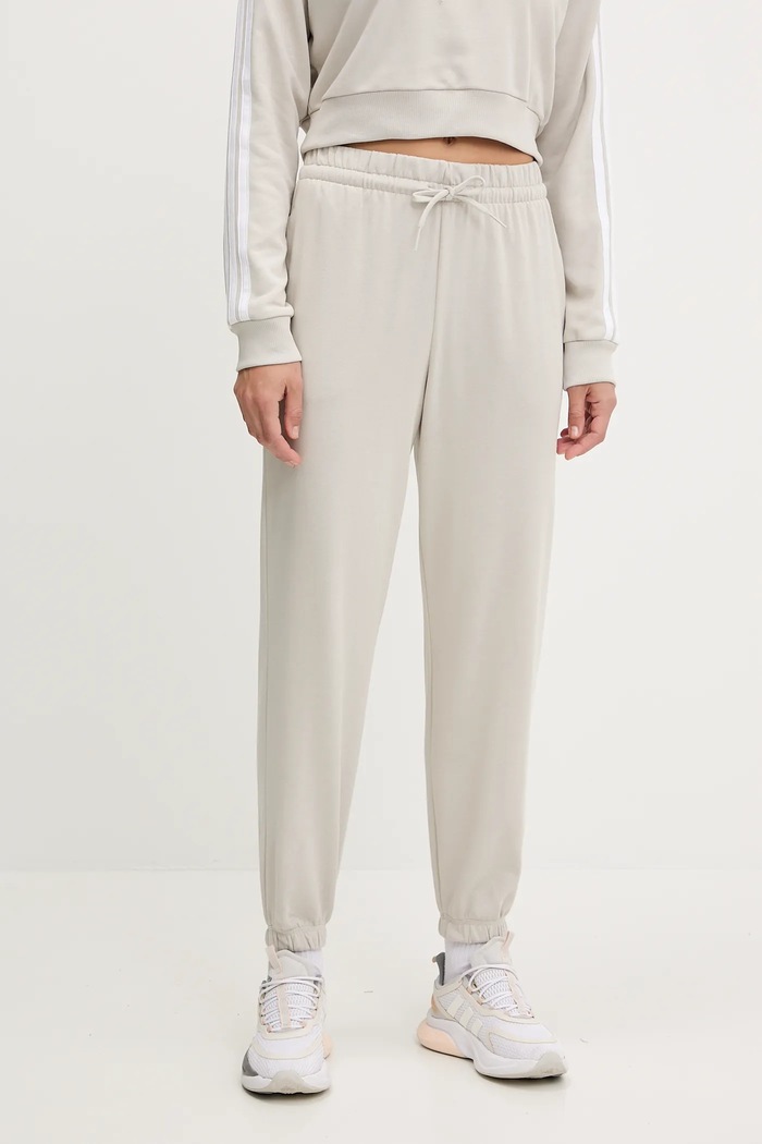 Tepláky adidas Essentials béžová JC8305