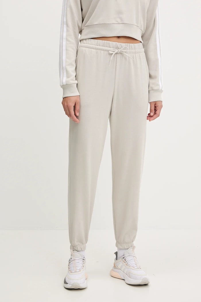 Tepláky adidas Essentials béžová JC8305