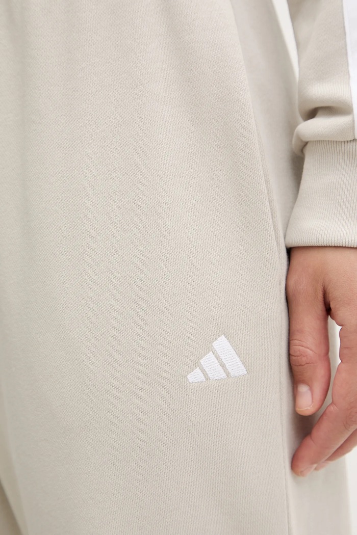 Tepláky adidas Essentials JC8305 béžová