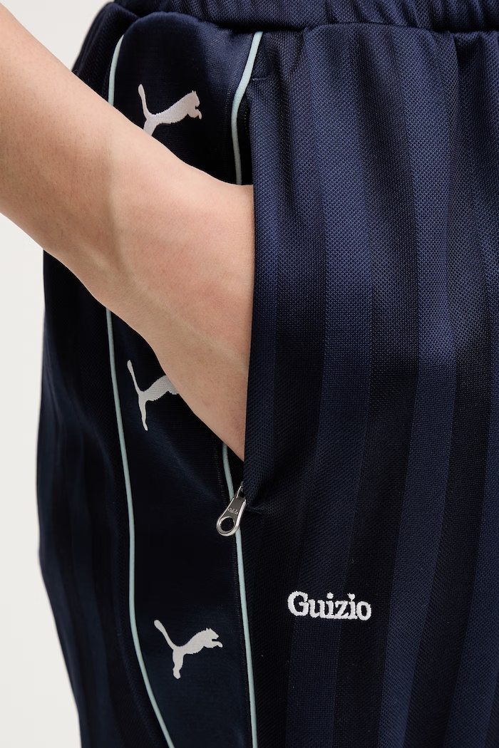 Puma pantaloni da tuta da donna PUMA x GUIZIO 632561 blu navy