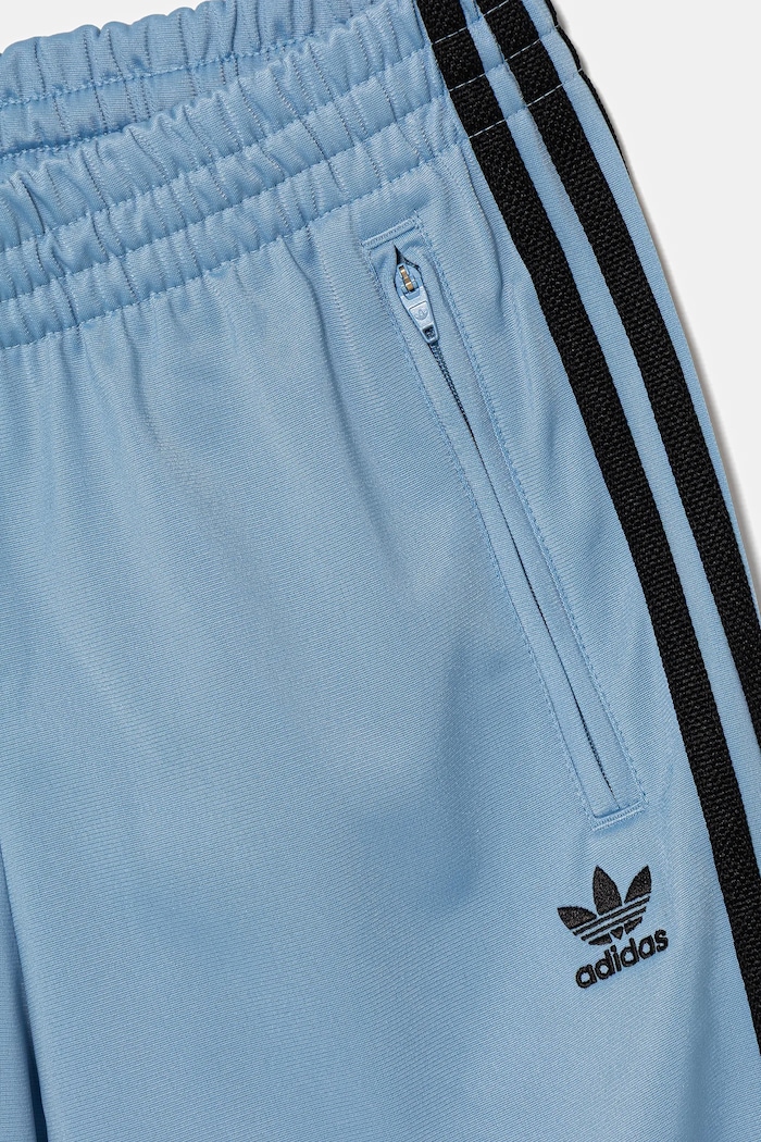 Otroški spodnji del trenirke adidas Originals modra JV8592