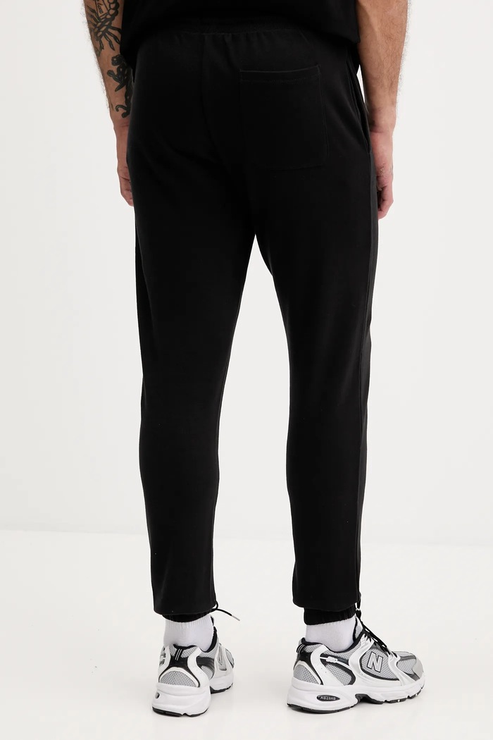 Дрехи Памучен спортен панталон Tommy Jeans DM0DM22094 черен