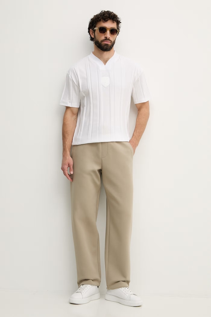 Armani Exchange spodnie dresowe męskie z bawełną XM001890.AF10818 beżowy SS26