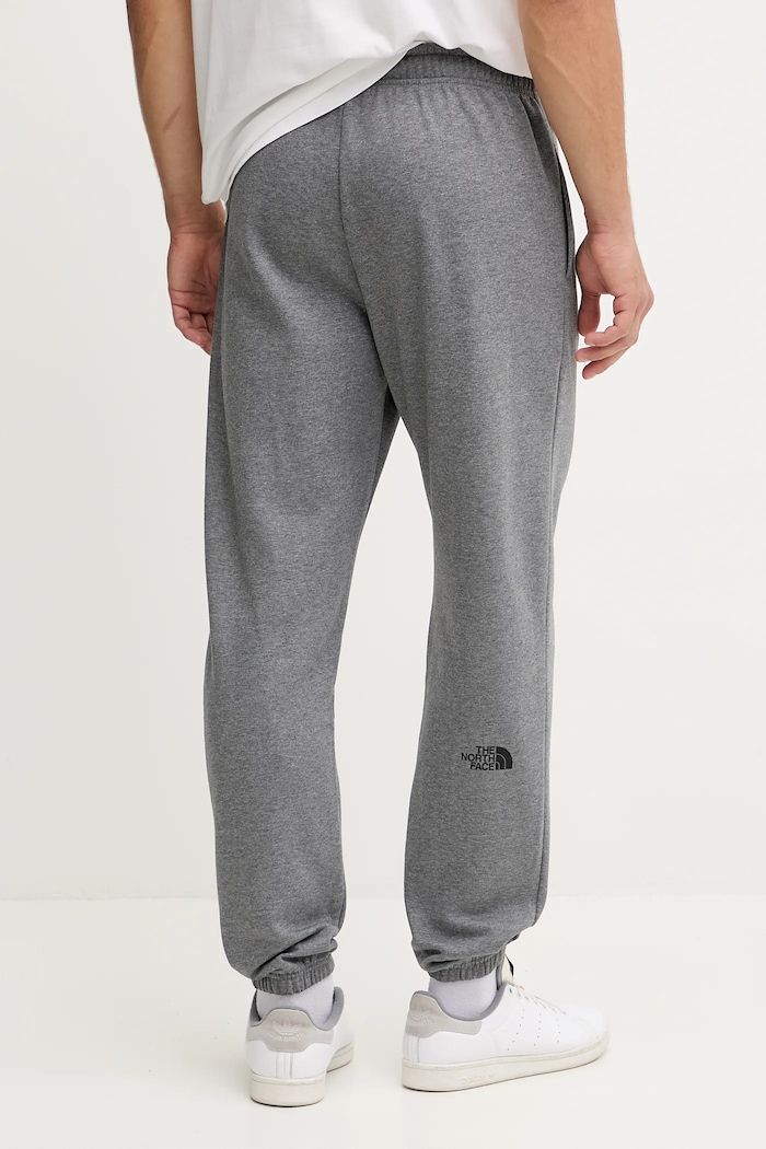 Odzież The North Face spodnie dresowe Simple Dome NF0A8C1WDYY1 szary
