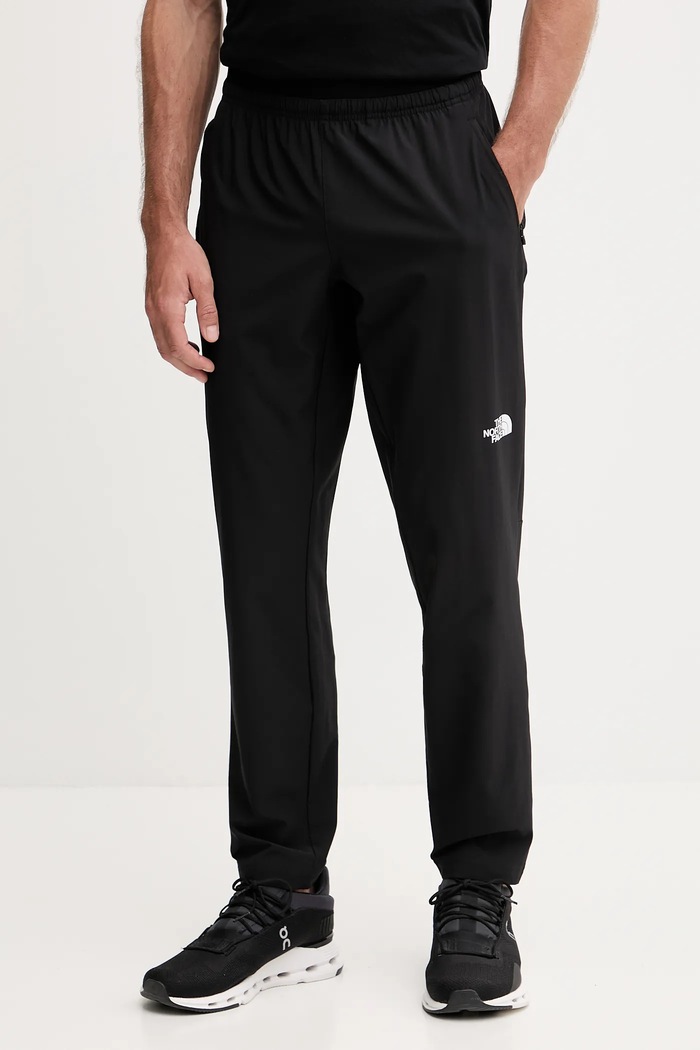 Tréninkové kalhoty The North Face látka černá NF0A8FJHJK31