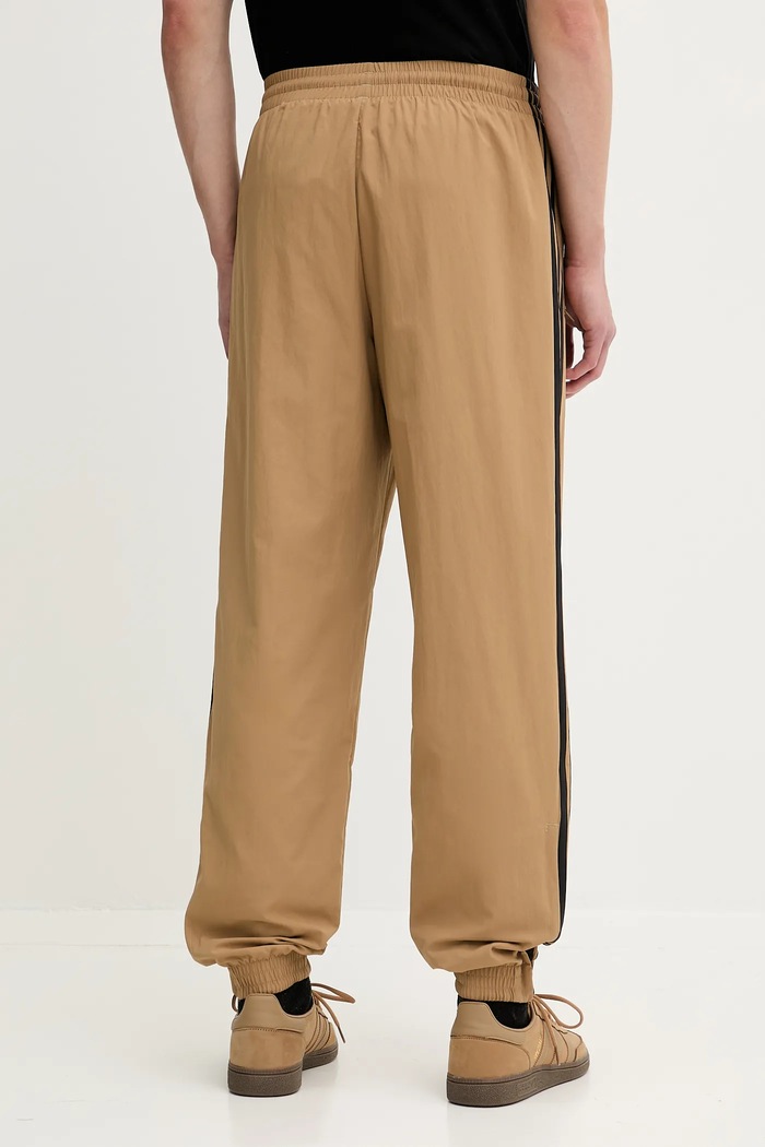 Odzież adidas Originals spodnie dresowe Firebird Pants JY1339 beżowy