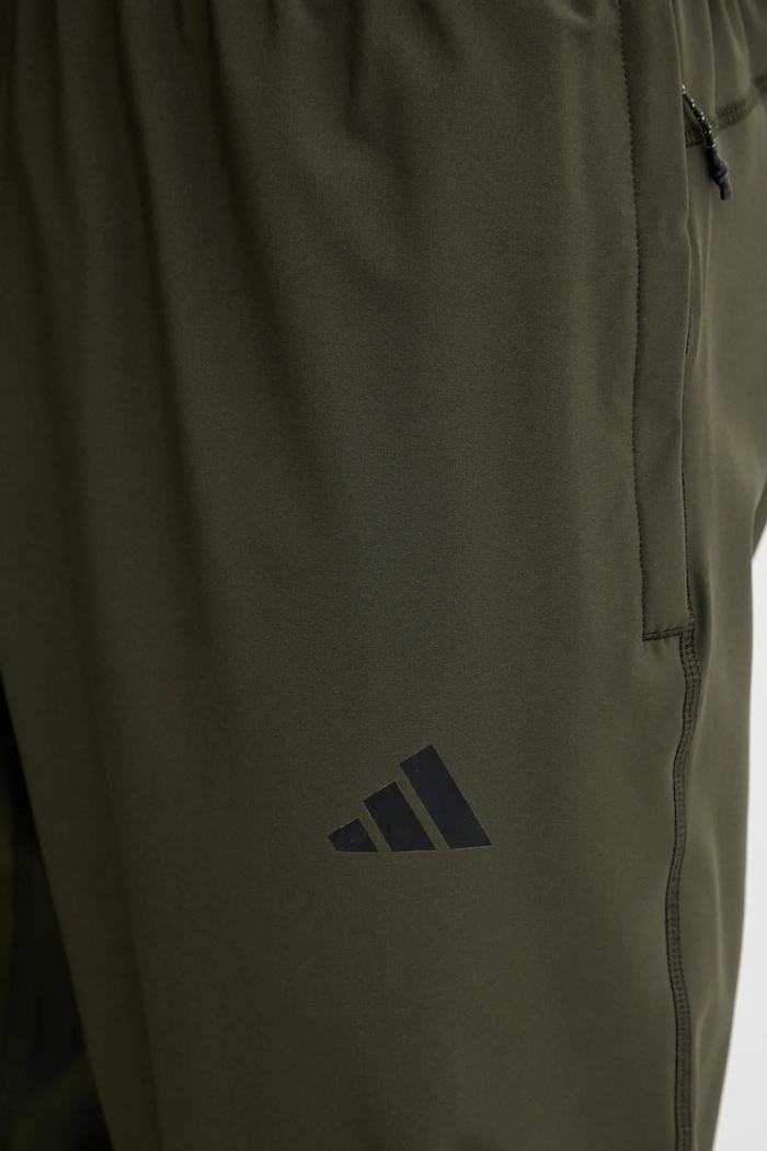 adidas Performance spodnie treningowe Tr-Es Woven zielony KA7859
