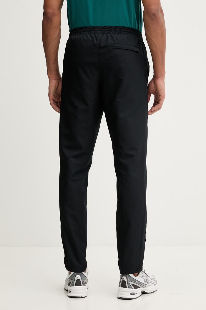 Odzież Under Armour spodnie dresowe 1390150 czarny