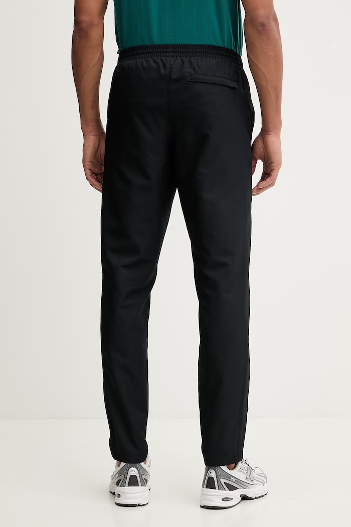 Odzież Under Armour spodnie dresowe 1390150 czarny