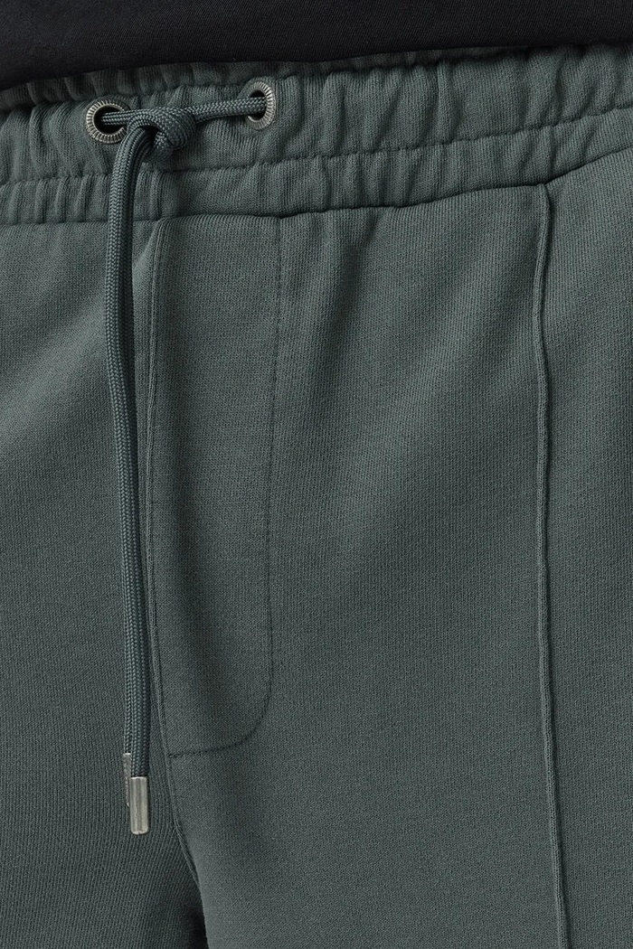 Oblečenie Bavlnené tepláky AllSaints MILO M010TD sivá