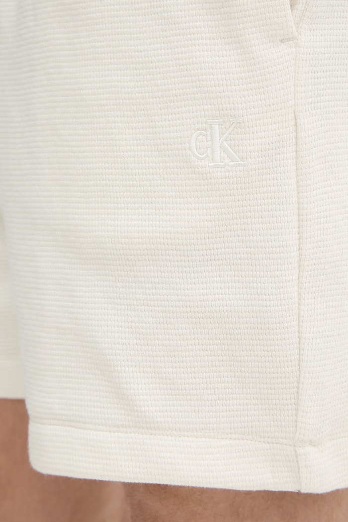 Calvin Klein Jeans teplákové šortky pánske bavlnené béžová LV04RC248G