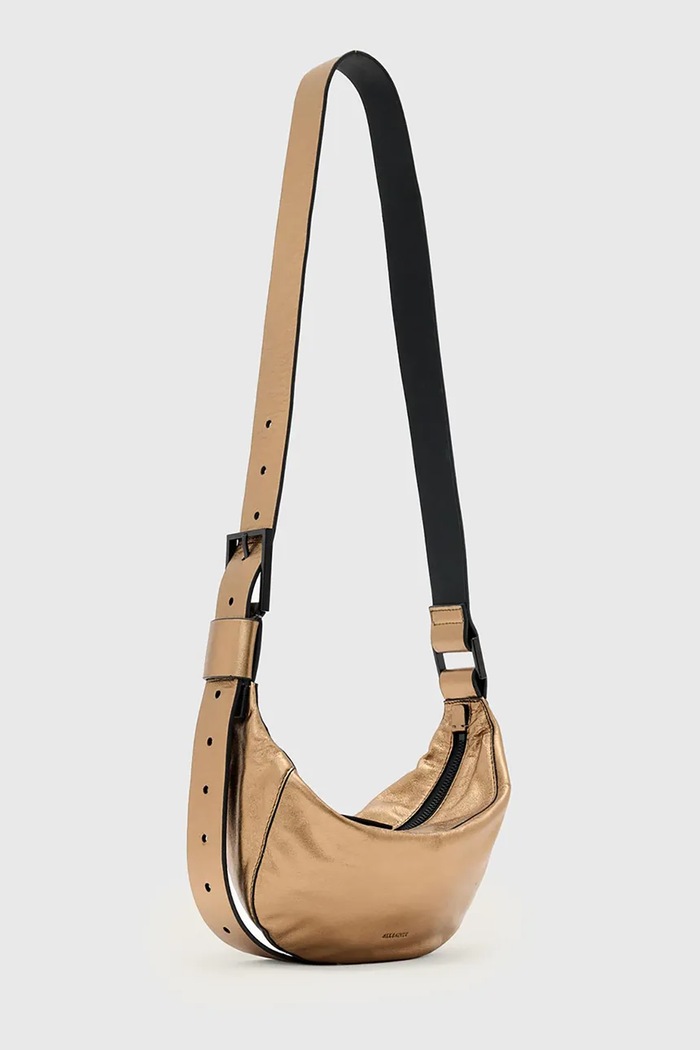 Kožna torba AllSaints LUNA W194XD zlatna AW25