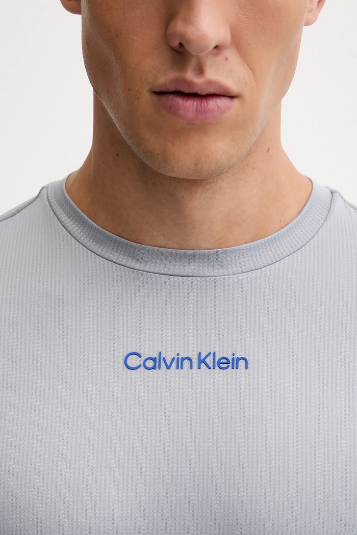 Tréningové tričko Calvin Klein Performance LVGMF5K101 sivá