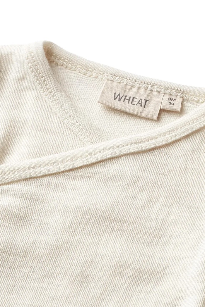 Chłopiec Wheat Body niemowlęce z wełny merino 9137.775.RWS beżowy