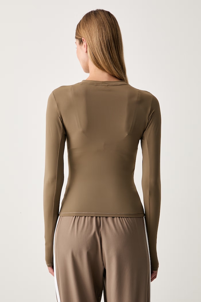 Odzież adidas Performance longsleeve treningowy damski Essentials KQ8388 zielony