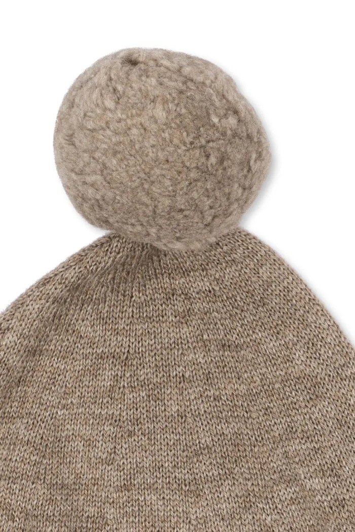 Konges Sløjd Czapka z pomponem dziecięca z wełną MATTOU KNIT HELMET KS106150.9BY2 brązowy AW26