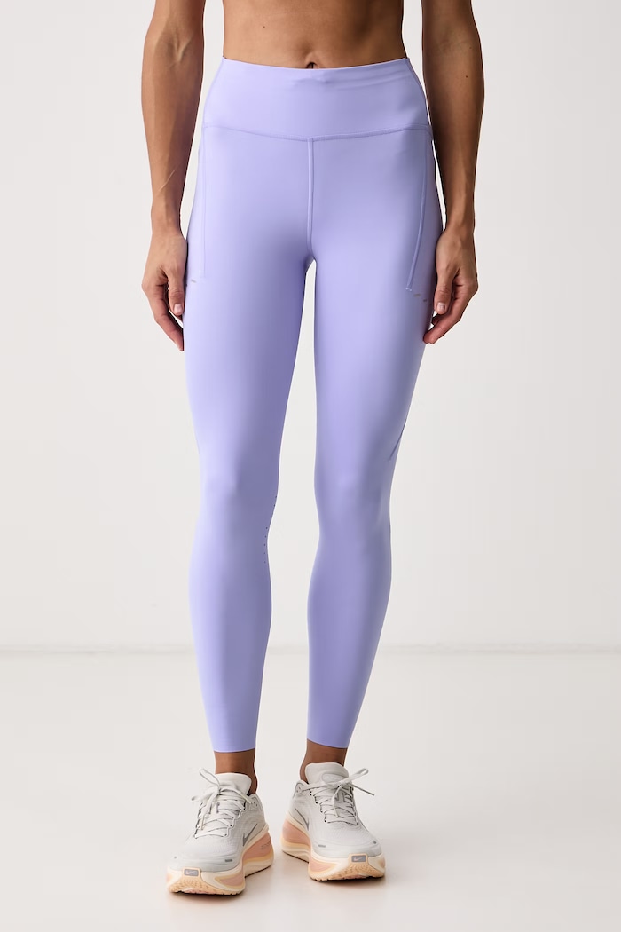 Nike Legginsy sportowe damskie Swift fioletowy HJ2252.580