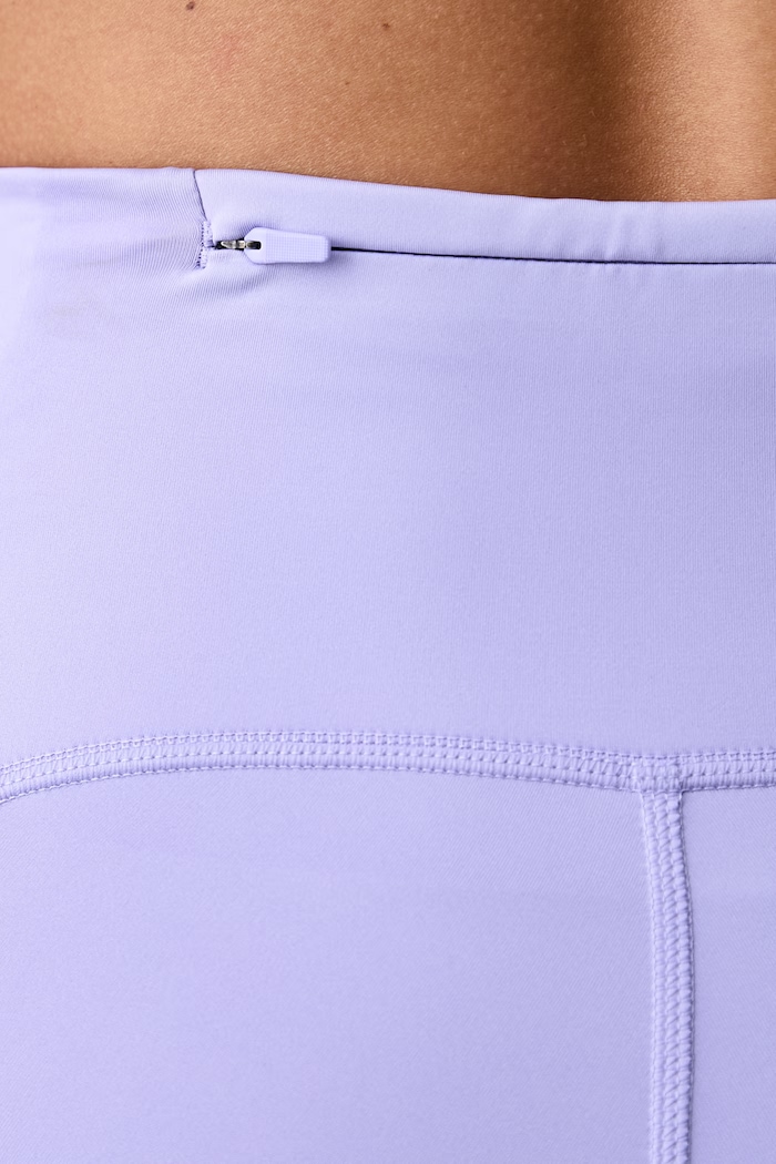 Legginsy sportowe damskie Swift Nike fioletowy HJ2252.580
