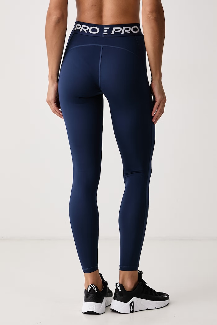Odzież Nike Legginsy sportowe damskie Nike Pro IQ0886.410 granatowy