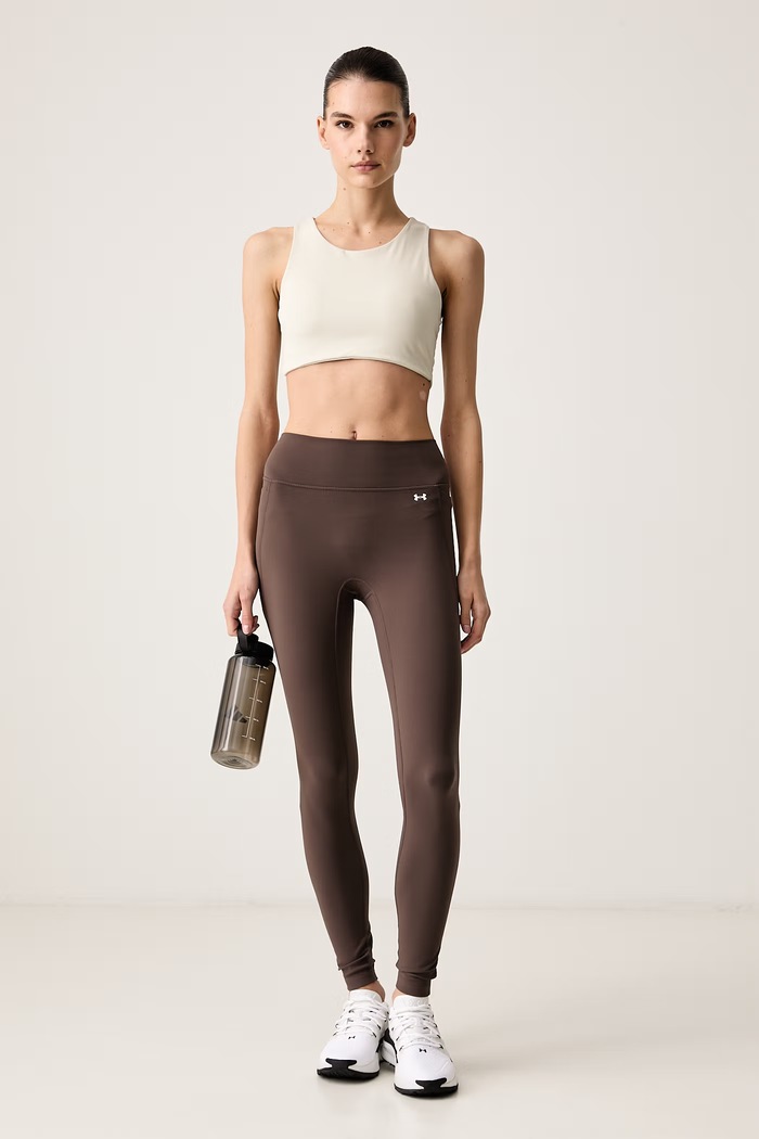 Under Armour Legginsy sportowe damskie Motion 6013786 brązowy AW26