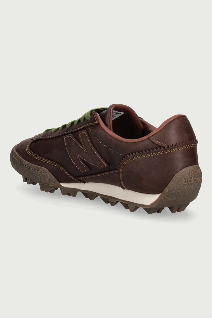 Obuwie New Balance Sneakersy męskie skórzane UGTRS5HP brązowy