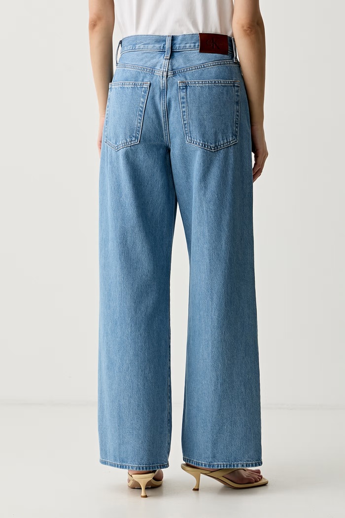 Oblačila Calvin Klein Jeans kavbojke s širokimi hlačnicami ženske LV047G906G modra